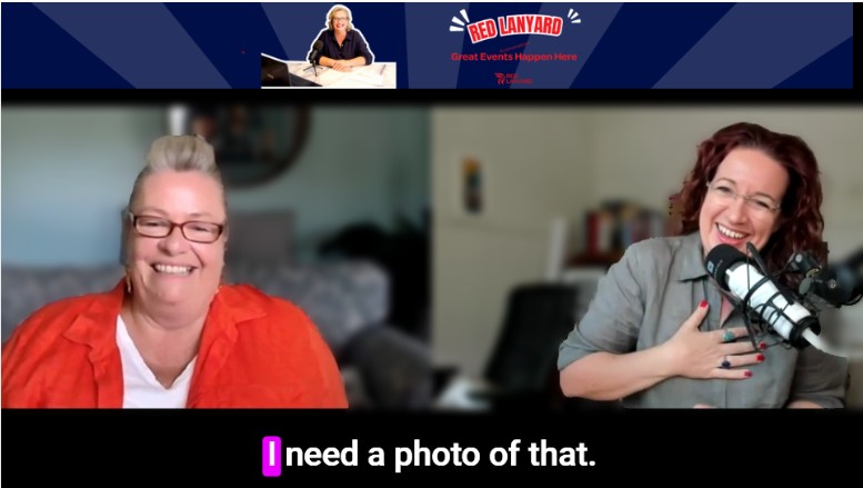 Screen shot of Sally and Cat laughing with the closed caption that reads "I need a photo of that".